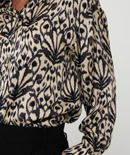 Load image into Gallery viewer, Close-up of abstract print top in beige and black against a white background.
