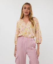Load image into Gallery viewer, Sunshine meets subtle gold shimmer in the Sella Solar Blouse by EsQualo. Designed with a fluid silhouette and lightweight drape, this relaxed top brings summer ease to any wardrobe. A soft geometric-inspired print gives the look an artful finish, while the breathable fabric makes it perfect for styling from brunch to beach strolls.
