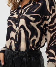 Load image into Gallery viewer, The exquisite Harmony print Blooma Blouse Mesh by EsQualo features faux pockets and gold buttons on the front, as well as a stunning abstract design in tan and black. With a double-layered construction to prevent transparency and button cuffs, this versatile top perfectly complements black pants, skirts, and jeans. Pair it with our Tanner Trousers Cargo City - EsQualo W2410709 for a chic and timeless look.
