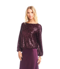 Load image into Gallery viewer, Woman wearing a purple sequin long sleeve blouse and purple silk skirt against a white background.
