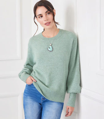 This versatile sweater features an easy fit and stylish blouson sleeves. Its comfortable design allows for effortless wear, while its trendy details add a touch of elegance.