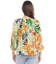 Load image into Gallery viewer, Experience the enchanting and whimsical feel of a floral garden with the Paiden Print Blouson Sleeve Top by Karen Kane. This expertly crafted top boasts a graceful crepe fabric that provides both comfort and style. The relaxed and laid-back attitude is enhanced by the blouson sleeves, making it a must-have addition to any wardrobe.
