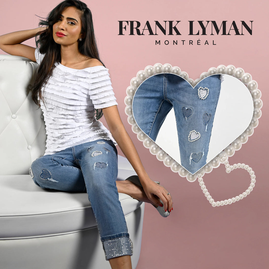 Add a touch of versatility and style to your wardrobe with the Blue Woven Denim Pant with Hearts, Pearls and Rhinestone Embellishments. This stunning piece features eye-catching heart embroidery, pearl and rhinestone details, and sparkling rhinestone hems, making it a statement piece for the spring/summer season. Don't miss out on the chance to sparkle and shine in these gorgeous jeans.