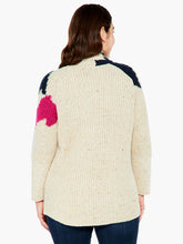 Load image into Gallery viewer, A super comfy classic shaker knit with a few modern touches. The details start at the yarn, where the dominant oatmeal color is accented by flecks of yellow and charcoal to add even more texture and interest. The intarsia knit blocks of black and pink do the rest. A slightly chunkier weight plus the shawl collar and extra length means it&#39;s perfect as an outer layer on crisper days.  Color-Neutral Multi - oatmeal, (flecks of yellow and charcoal) black, pink. Intarsia knitting. Heavier weight.
