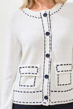 Load image into Gallery viewer, Woman wearing a white and navy contrast stitch cardigan against a white background.
