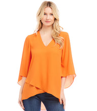 Load image into Gallery viewer, Floaty layers bring soft movement to a silky crepe blouse that can be worn for work or the weekend. The V-neck design adds a touch of femininity, while the 3/4 bracelet sleeves and eye-catching asymmetric crossover hem add a contemporary edge to a classic style.
