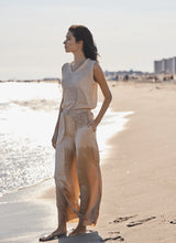 Load image into Gallery viewer, Add a touch of shimmer to your summer wardrobe with the Bria Sequined V-Neck Shell by Lysse. This sleeveless stunner features a flattering V-neckline and a relaxed silhouette that drapes beautifully over the body. Delicate sequins catch the light with every movement, offering just the right amount of sparkle for day-to-night styling.
