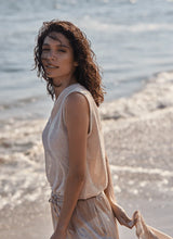 Load image into Gallery viewer, Add a touch of shimmer to your summer wardrobe with the Bria Sequined V-Neck Shell by Lysse. This sleeveless stunner features a flattering V-neckline and a relaxed silhouette that drapes beautifully over the body. Delicate sequins catch the light with every movement, offering just the right amount of sparkle for day-to-night styling.
