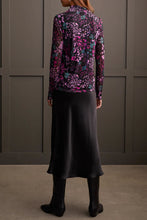 Load image into Gallery viewer, Our Blessyn Bright Violet Lined Turtleneck Top offers the perfect blend of comfort fused with contemporary style. Made from high quality, this turtleneck boasts a striking abstract design combining floral and animal prints, bringing a unique flair to your daily attire.&nbsp; Perfect for laid-back events or elegant affairs, this colorful top is sure to be a highlight in any trendsetting wardrobe.
