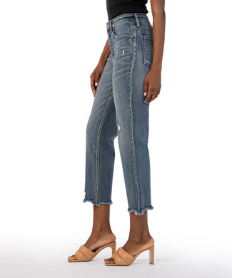 Crafted from comfortable, stretchy denim with subtle distressing, these high-rise jeans are tapered and cropped to replicate the iconic '90s aesthetic. Perfect for any occasion, these jeans offer a versatile wash and timeless style. Color: Built with medium base wash. True to size fit. High rise. Inseam- 26 inch. Perfect stretch. Slight distressing. Frayed hem. Functional front and back pockets.