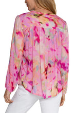 Load image into Gallery viewer, The Fuchsia Watercolor Button Front Shirred Blouse is a stunning addition to any wardrobe, perfect for showcasing contemporary femininity. Its beautiful design features a shirred back, making it a gorgeous statement piece that is sure to garner compliments. For a sophisticated and elevated look, pair it with denim and heels for a night out on the town. For added coverage, pair it with our nude cami.
