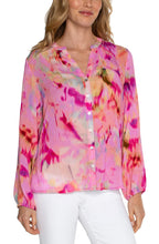 Load image into Gallery viewer, The Fuchsia Watercolor Button Front Shirred Blouse is a stunning addition to any wardrobe, perfect for showcasing contemporary femininity. Its beautiful design features a shirred back, making it a gorgeous statement piece that is sure to garner compliments. For a sophisticated and elevated look, pair it with denim and heels for a night out on the town. For added coverage, pair it with our nude cami.
