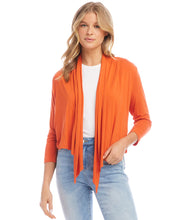 Load image into Gallery viewer, Elevate your style with this versatile cardigan that is perfect for throwing over a dress for a night out or pairing it with your favorite jeans for a casual day. The relaxed silhouette drapes effortlessly, creating a flattering and comfortable fit.
