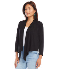 Load image into Gallery viewer, Woman wearing a black cardigan over a white top and blue jeans on a white background.
