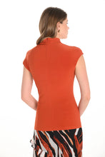 Load image into Gallery viewer, Woman wearing an orange cap sleeve top with a zebra print skirt against a white background.
