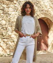 Load image into Gallery viewer, This exquisite gold long open knit cardigan offers endless styling options. It can be effortlessly layered over dresses, tops, or even a swimsuit for a sophisticated look at the pool or beach.
