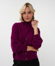 Load image into Gallery viewer, Woman wearing a purple sweater cardigan over matching sleeveless turtleneck and black pants against a white background.
