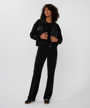 Load image into Gallery viewer, Person wearing a black jacket, black tee, black pants and black sneakers against a white background.
