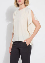 Load image into Gallery viewer, Breezy elegance meets modern versatility in the Carmen "V" Neck Scarf Top by Lysse. Crafted from lightweight Stretch Woven fabric with 2-way stretch, this flowy silhouette is designed to move with you—offering a relaxed fit that flatters without clinging. The unique scarf-inspired construction features two stitched side panels that release at the shoulders, creating graceful drape and dimension with every step.
