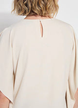 Load image into Gallery viewer, Breezy elegance meets modern versatility in the Carmen "V" Neck Scarf Top by Lysse. Crafted from lightweight Stretch Woven fabric with 2-way stretch, this flowy silhouette is designed to move with you—offering a relaxed fit that flatters without clinging. The unique scarf-inspired construction features two stitched side panels that release at the shoulders, creating graceful drape and dimension with every step.
