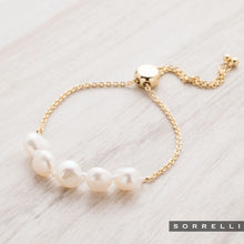 Load image into Gallery viewer, Perfect for any wrist, this timeless bracelet showcases an adjustable design embellished with freshwater pearls. A versatile piece suitable for any occasion.
