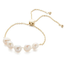 Load image into Gallery viewer, Perfect for any wrist, this timeless bracelet showcases an adjustable design embellished with freshwater pearls. A versatile piece suitable for any occasion.
