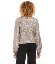 Load image into Gallery viewer, This stunning top offers unparalleled comfort and shimmer. A champagne-colored sequin design offers a stunning visual aesthetic. Wear it to events to make an impression without sacrificing comfort. Create a sophisticated look when paired with black trousers or a chic look when styled with cream or blue denim.  Color- Champagne. V-neck. Elasticized hem. Lined. Fabric -Sequin Mesh: 90% Nylon. 10% Spandex. Care -Dry clean.
