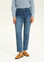 Load image into Gallery viewer, Elevate your everyday style with the Christina Straight Ankle Denim—a perfect blend of comfort, versatility, and timeless elegance. Designed for a flattering fit, these jeans feature a classic 5-pocket design with delicate floral details adorning the front, adding a feminine touch to their structured silhouette.
