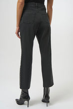 Load image into Gallery viewer, Model wearing dark grey studded jeans and black high heeled boots against a white background.
