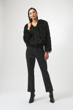 Load image into Gallery viewer, Woman wearing a black faux fur jacket, dark grey studded jeans and black boots against a white background.
