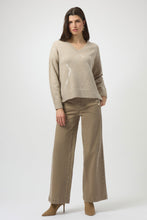 Load image into Gallery viewer, Woman wearing a beige sweater, warm taupe wide-leg jeans and taupe suede boots against a white background.
