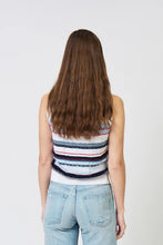 Load image into Gallery viewer, Woman wearing a sleeveless blue and multi stripe top and blue jeans against a white background.
