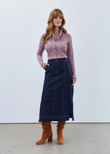 Load image into Gallery viewer, Woman wearing a patterned top, long denim skirt and brown boots against a white background.
