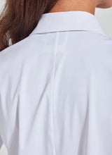 Load image into Gallery viewer, Close-up back view of a person wearing a white collared shirt, showing the center back seam and collar area.
