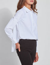 Load image into Gallery viewer, A woman wearing a white long-sleeve button-up blouse tucked into black pants, shown from the side against a light gray studio background.
