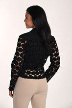 Load image into Gallery viewer, Woman wearing a modern black dot jacket over a black tank and tan pants against a white background.
