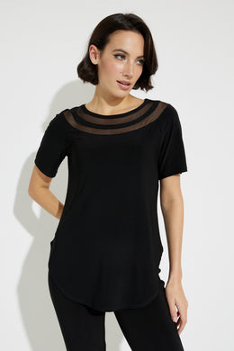Every lady needs a basic black top in their closet that essentially pairs with every bottom owned.  This basic black, short sleeve, tunic length top is anything but basic though!  Sheer trim detailing around the neckline, enhances and elevates the look of our Blaire short sleeve top.  Elevate your everyday look with this fabulous top.  Color -Black. Sheer trim detailing around neckline. Pullover. Tunic length. Short sleeve. Scoop hem.