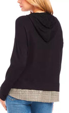 Load image into Gallery viewer, This black Karen Kane hoodie boasts a contrast hem wit dazzling tiny sequins design that elevates its classic style. Crafted with high-quality materials, it offers both comfort and style, making it a perfect choice for any casual occasion. Stay cozy and fashionable with this stylish addition to your wardrobe.
