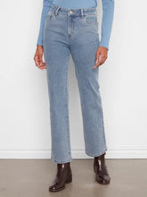 Load image into Gallery viewer, Model wearing light blue corduroy pants with a blue top and brown boots against a white wall.
