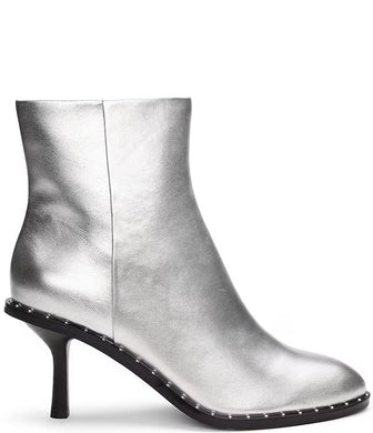 Make a fashion statement with these round-toe ankle boots. Adorned with a dazzling silver metallic color, studded detailing, and a robust stiletto heel, these boots add a dash of urban elegance and individual flair to any outfit.