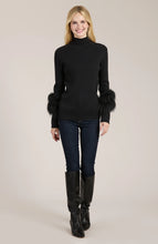 Load image into Gallery viewer, Elevate your turtleneck with a hint of faux fur that rivals the appearance of real fur. This distinctive touch transforms a basic item into a versatile piece suitable for any event, whether during the day or at night. Dress up with a skirt or trouser or show off a modern, casual vibe with your favorite denim.
