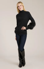 Load image into Gallery viewer, Elevate your turtleneck with a hint of faux fur that rivals the appearance of real fur. This distinctive touch transforms a basic item into a versatile piece suitable for any event, whether during the day or at night. Dress up with a skirt or trouser or show off a modern, casual vibe with your favorite denim.
