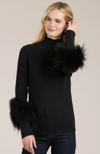 Load image into Gallery viewer, Elevate your turtleneck with a hint of faux fur that rivals the appearance of real fur. This distinctive touch transforms a basic item into a versatile piece suitable for any event, whether during the day or at night. Dress up with a skirt or trouser or show off a modern, casual vibe with your favorite denim.
