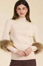 Load image into Gallery viewer, Elevate your turtleneck with a hint of faux fur that rivals the appearance of real fur. This distinctive touch transforms a basic item into a versatile piece suitable for any event, whether during the day or at night. Dress up with a skirt or trouser or show off a modern, casual vibe with your favorite denim.
