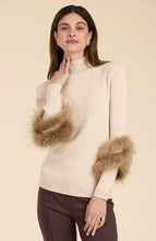 Load image into Gallery viewer, Elevate your turtleneck with a hint of faux fur that rivals the appearance of real fur. This distinctive touch transforms a basic item into a versatile piece suitable for any event, whether during the day or at night. Dress up with a skirt or trouser or show off a modern, casual vibe with your favorite denim.
