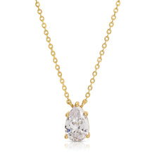 Load image into Gallery viewer, his gorgeous Country Club Necklace is a stunner and certainly will add extra shine to your everyday outfit! A sparkling pear shape cubic zirconia hangs from a dainty gold chain.  A perfect necklace to wear alone or layer with your other favorite pieces.  Colors- Gold and clear. Cubic zirconia. 14 kt gold plating over brass. Measures 17 inches with a 2&quot; extender.
