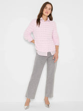 Load image into Gallery viewer, Woman wearing fuzzy pink sweater over a pink blouse, gray pants and silver heels against a white background.
