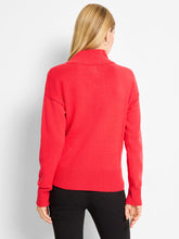 Load image into Gallery viewer, Woman wearing red sweater and black pants against a white background.
