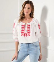 Load image into Gallery viewer, Lightweight cotton gives a breezy quality to this peasant top detailed with charming floral embroidery. Pair this top with high-waist jeans for a polished look.   Create the perfect look when paired with our REBECCA RED CAPRI PANT - KAREN KANE  Colors- Cream and red. Blouson sleeve. V-neckline. Embroidered. Fabric -100% Cotton.
