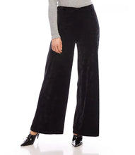 Load image into Gallery viewer, Discover our Crushed Velvet Pants, crafted from a plush, stretchable fabric for supreme comfort. Ideal for any event, these pants will enhance your collection with their sumptuous texture.
